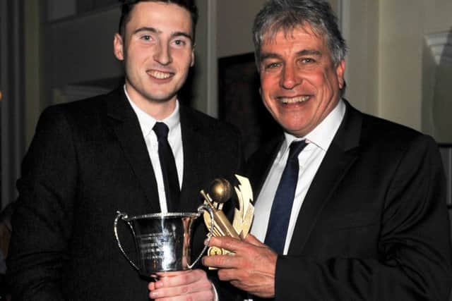Sleaford's Tom Shorthouse (left) receives the Stephen Bradford Memorial Award for the best all rounder from BBC broadcaster John Inverdale at the ECB presentation night at Hemswell Court. Photo: Nigel West