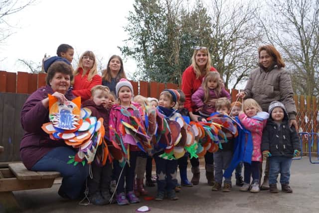 Children and staff at Pegasus with the dragon their made for Chinese New Year EMN-160203-121424001