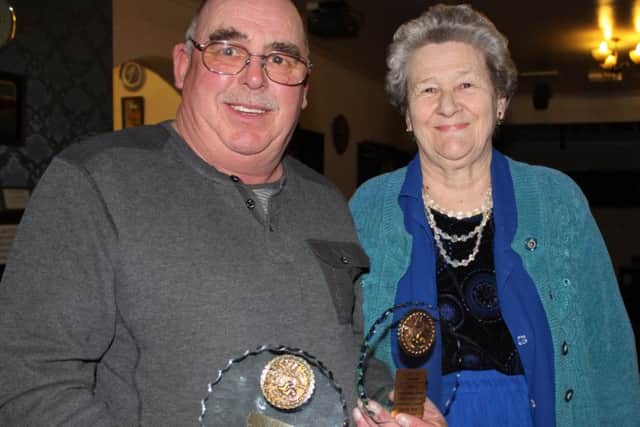 Dave Burr receiving one of his trophies from Christine Faithful.