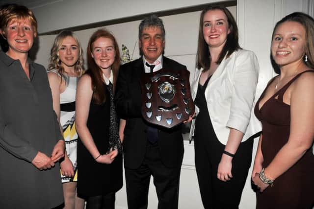 Just champion! Market Rasen Women's cricketers are seen receiving their Lincolnshire championship trophy from sports journalist and broadcaster John Inverdale. From left are Catherine Fussey, Rebecca Brooker, Megan Quinlan, Bethany Smith and Niamh Skipworth.
