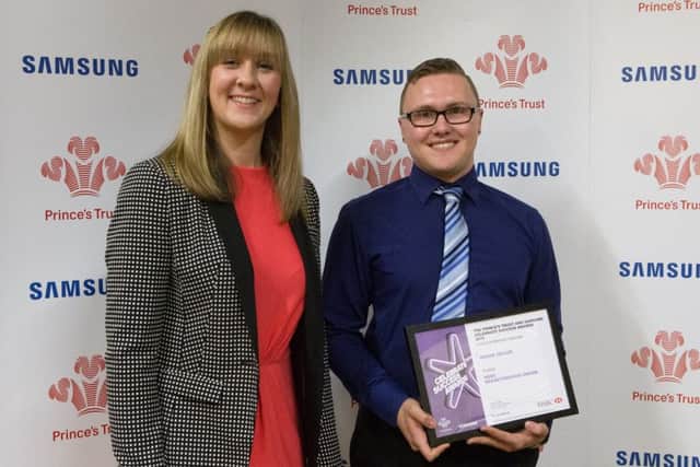 Shaun Taylor of Pinchbeck receiving the runners-up prize for the HSBC Breakthrough Award from the bank's regional support manager Rebecca Knowlson.