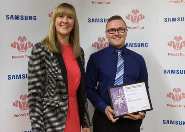 Shaun Taylor of Pinchbeck receiving the runners-up prize for the HSBC Breakthrough Award from the bank's regional support manager Rebecca Knowlson.