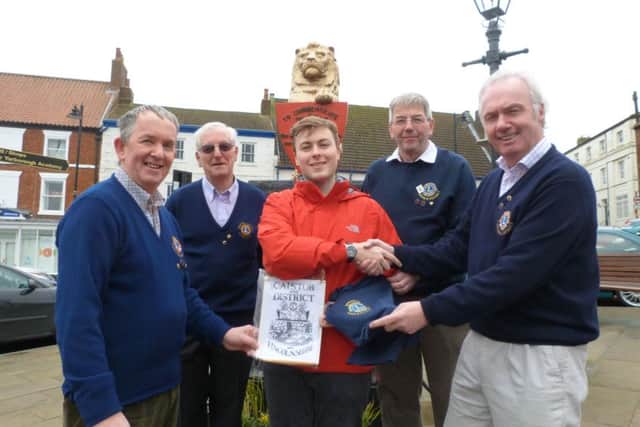 Lion Andrew Cordery, Lion Bob Oxley, Adam Butterfield, Lion Colin Tym and Vice President Peter Morris. EMN-160229-124959001