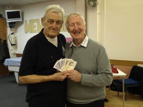 John Monk (MBE) and Bob Dawes receiving the money.