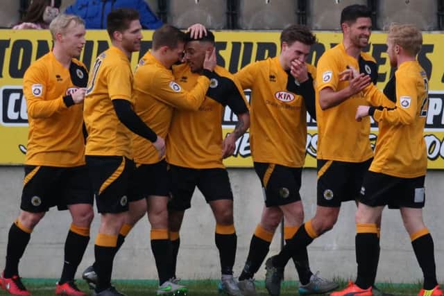 United celebrate Rollins' opener.
