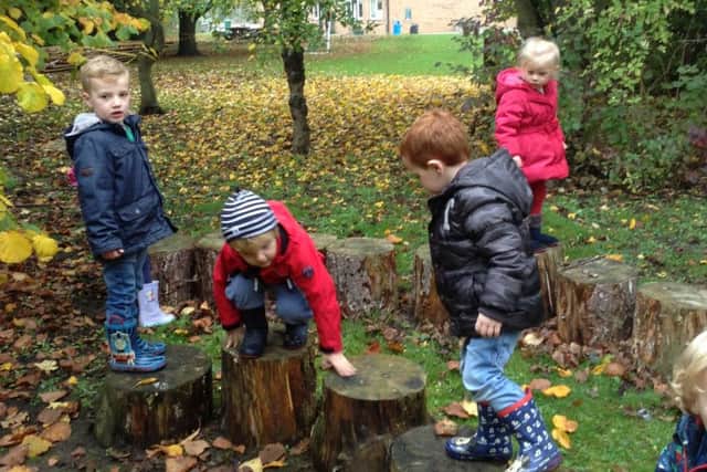Children enjoy some outdoor play at Heckington Pre-School.