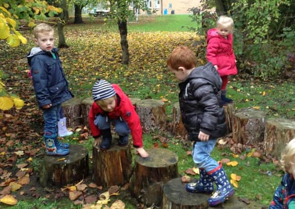Children enjoy some outdoor play at Heckington Pre-School.
