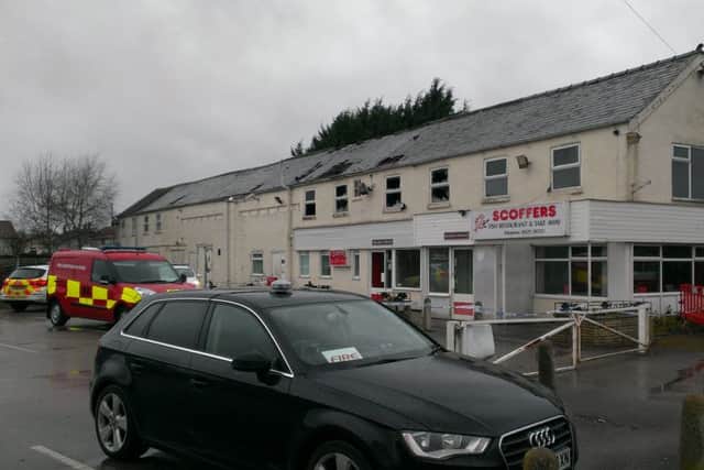 Fire investigators move in on Tuesday to establish the cause of the chip shop blaze. EMN-160203-150336001