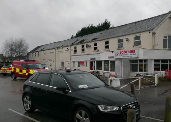 Fire investigators move in on Tuesday to establish the cause of the chip shop blaze. EMN-160203-150336001