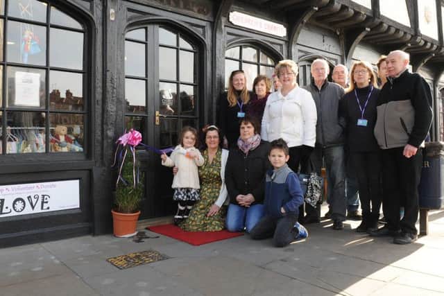 New Loveshack Hobby Shop on South Street, Boston. Officially opened by disabled girl Jeanie Walsh-Dodd, five. Pictured with founder of the charity Karen Ward, volunteers and committee members.