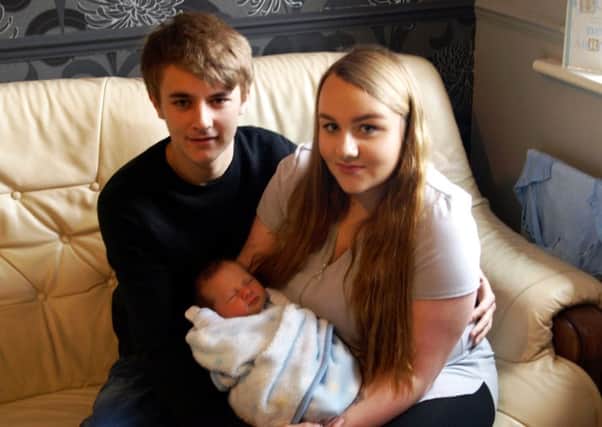 New parents Jack Coddington and Lauren Tindall with their son Kyran.