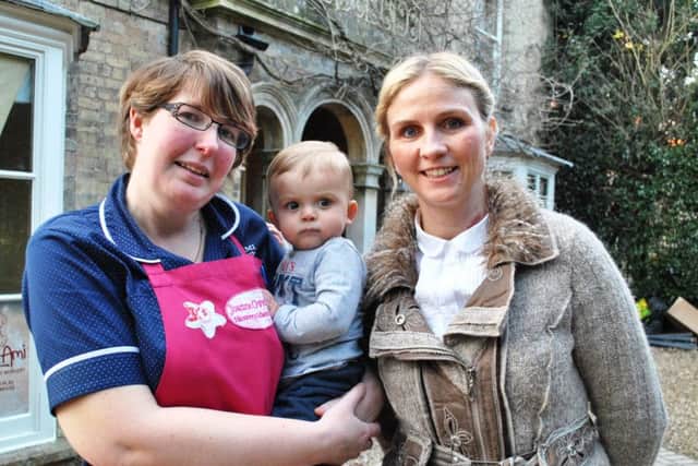 Jo Overton (manager of Mon Ami in Alford), with owner Samantha Britton and little Bobby Stead. MLOP-09-03-16Alford Mon Ami Nursery Ofsted pic ANL-160314-094431001