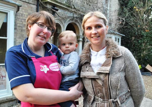 Jo Overton (manager of Mon Ami in Alford), with owner Samantha Britton and little Bobby Stead. MLOP-09-03-16Alford Mon Ami Nursery Ofsted pic ANL-160314-094431001