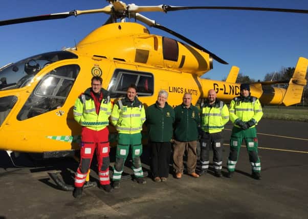 William and Fiona Elkington of Rauceby War Weekend deliver Â£12,000 to the Air Ambulance crew. EMN-160803-115214001