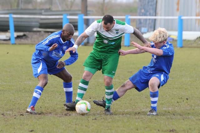 Terry Fleming and Jack Dykes close in on their Swans opponent.