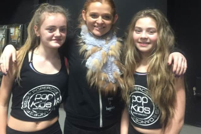 Lizzy Jervis (centre) with two Popercise pupils.