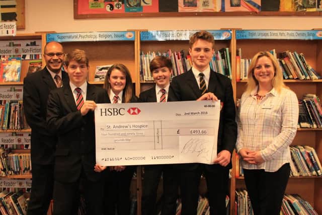 Cordeaux Academy Principal Patrick Daley and St Andrew's Children's Hospice representative ZaZa Warren, alongside pupils Oscar Burkitt, Jazmyn Urry, Jack Hanson and Max Langdale.