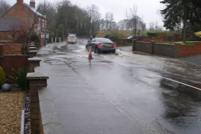 Severe flooding at one of the main entrances to the town in Eastfield Road - near to the proposed 46 home development site.
