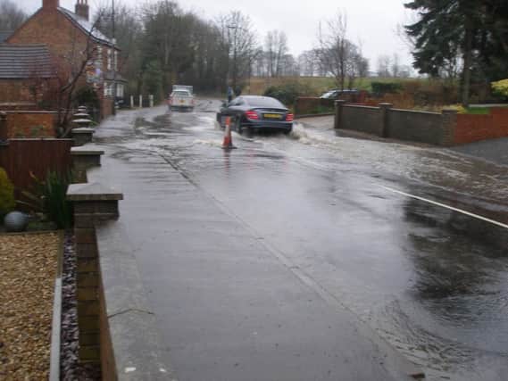 Severe flooding at one of the main entrances to the town in Eastfield Road - near to the proposed 46 home development site.