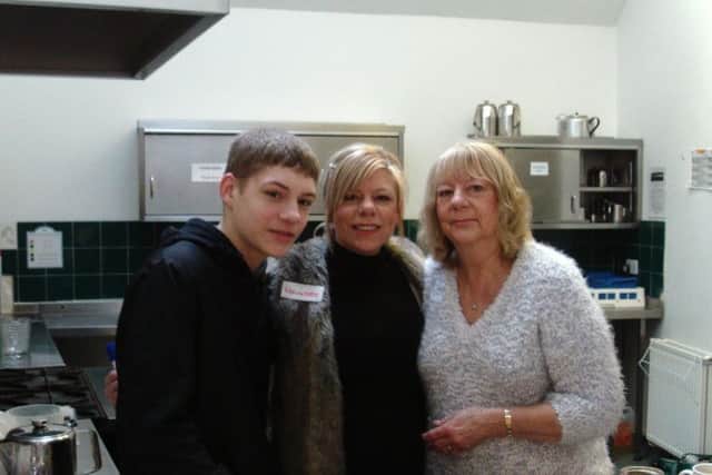 Ellis Duncan (son), Lisa Virgo and her mum Mary Major, who donated the homemade cakes to sell.