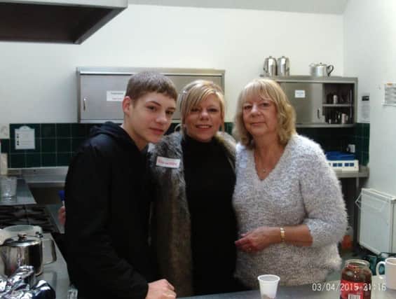 Ellis Duncan (son), Lisa Virgo and her mum Mary Major, who donated the homemade cakes to sell.