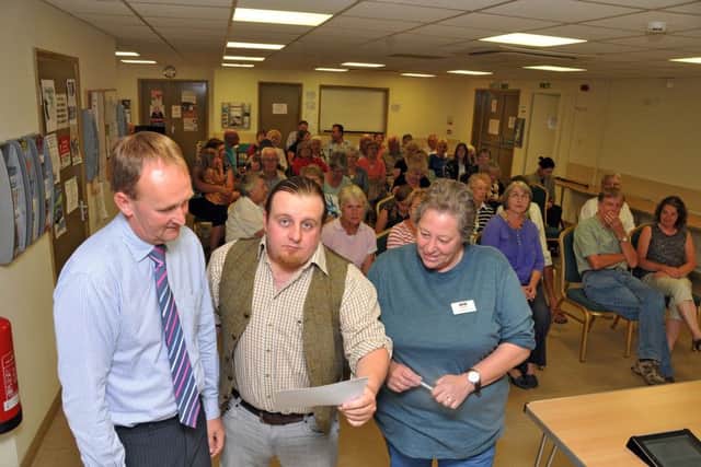 County councillor Nick Worth, Peter Lorimer and district councillor Jane King at a public meeting in 2013 to discuss the county's library proposals. SG300813-227TW