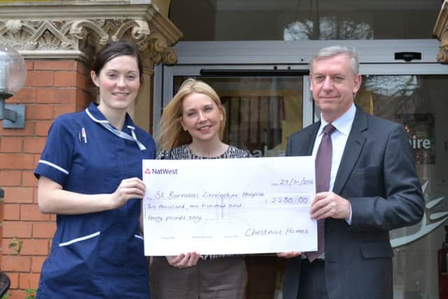 Sarah Jowett and David Newton of Chestnut Homes present a cheque to St Barnabas Lincolnshire Hospice EMN-160315-112625001