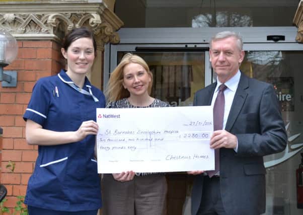 Sarah Jowett and David Newton of Chestnut Homes present a cheque to St Barnabas Lincolnshire Hospice EMN-160315-112625001
