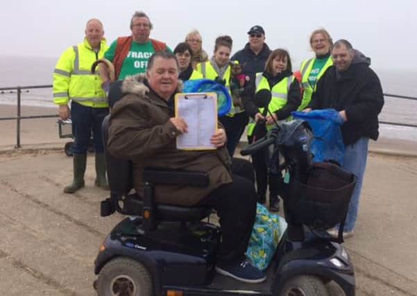 Paul Marshall, of Coastal Access for All, with volunteers at the beach clean in Skegness. ANL-161203-164200001