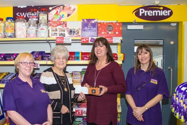 Pictured are staff members Karen Corker and Emma Wenlock with Margaret Conyers and Elena Fraser Green of The Blind Society.