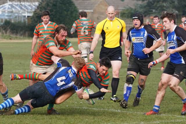 Nick Harvey is hauled down as Rasen search out another score against Grimsby EMN-160314-111327002