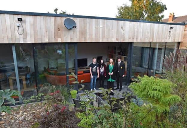 The McGarry family outside their eco home in Horncastle EMN-160314-114238001