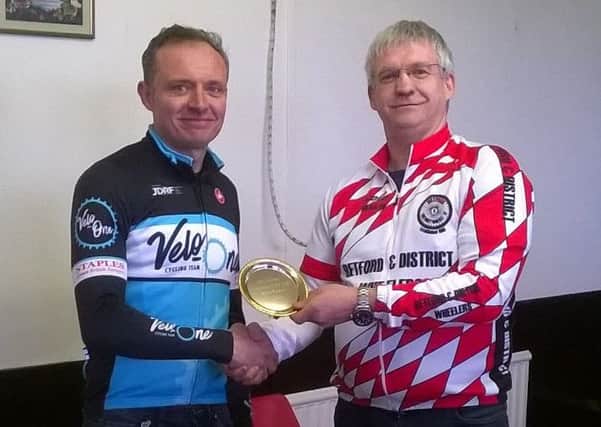 Neil Palmer receives his trophy for second place in the Retford 10.