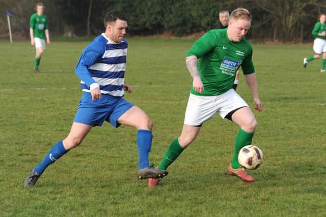 Heckington Millers (green) v Benington (blue). Shane Clancy (green), Gav Bell (blue). EMN-160314-162627002
