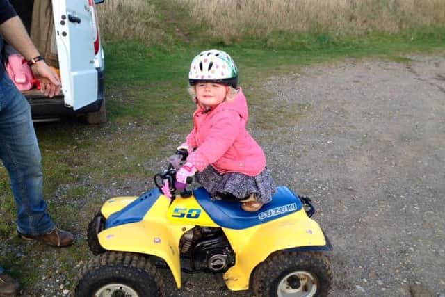 Four-year-old Sienna enjoys a ride on her beloved quad bike, which was stolen by heartless thieves last week. YGMcwQcT9c1h2oMw0PiR
