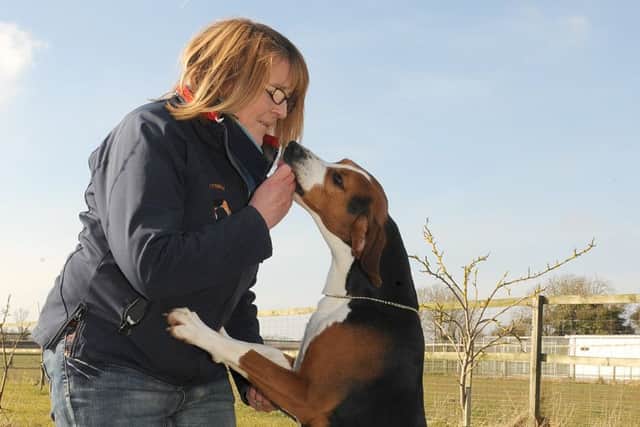 Angela and Roland share a biscuit.
