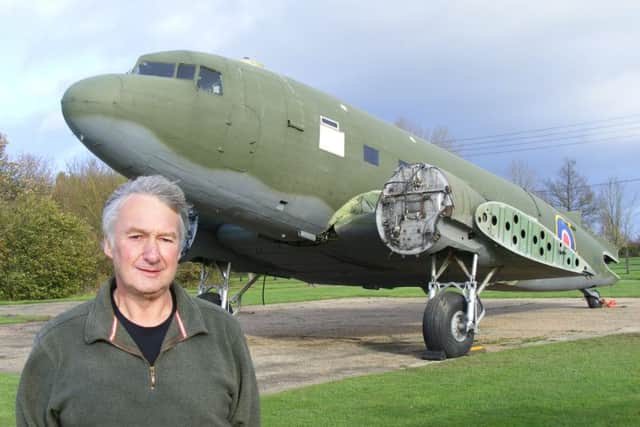 Chairman of the Friends of Metheringham Airfield Andy Marson and the Dakota - almost back in once piece. EMN-160315-135355001