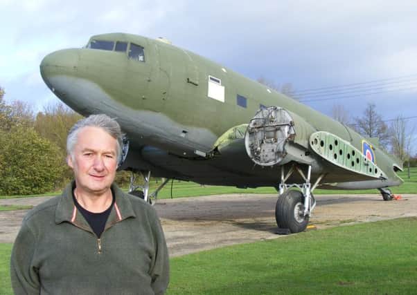 Chairman of the Friends of Metheringham Airfield Andy Marson and the Dakota - almost back in once piece. EMN-160315-135355001