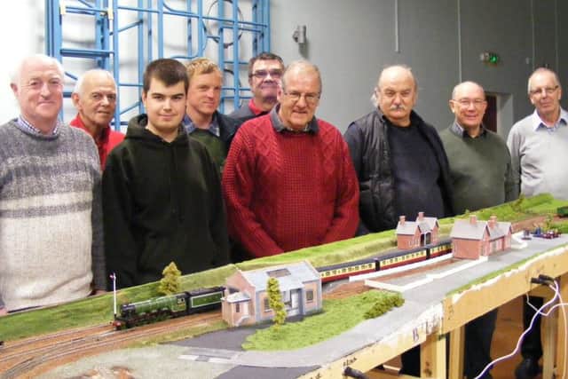 Members of Sleaford Model Railway Club with their latest lay-out. EMN-160320-134124001