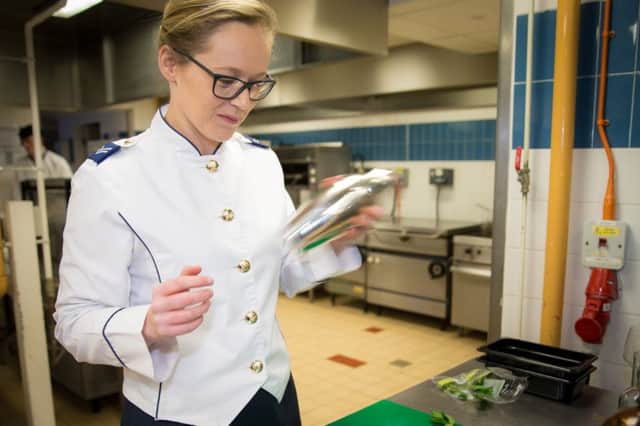A member of the catering staff at RAF Coningsby checks everything is ready ahead of the big day. Photo By:- SAC Megan Woodhouse (RAF) EMN-160316-135806001