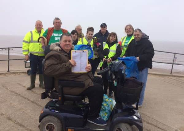 Paul Marshall (front) and volunteers at the beach clean in Skegness. ANL-160317-095924001
