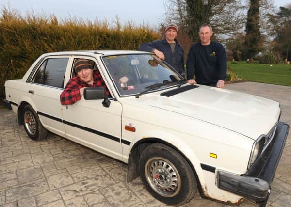 Pictured (from left) Carl Bolland, Stephen King and Mark Taylor with the Triumph car they have bought to take part in the Club Triumph Round Britain Reliability Run.