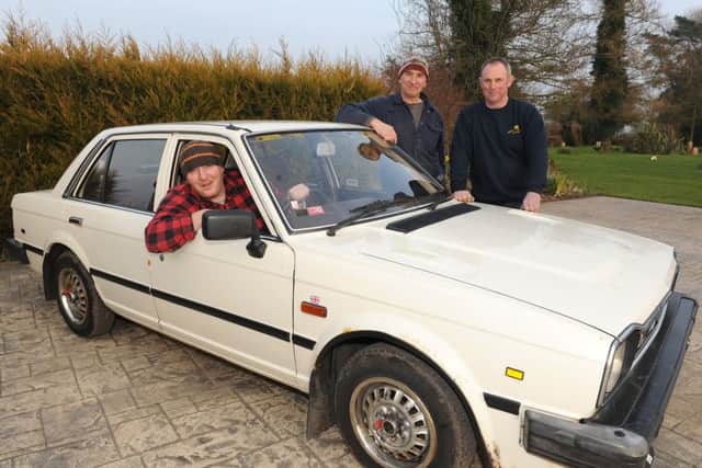 Pictured (from left) Carl Bolland, Stephen King and Mark Taylor with the Triumph car they have bought to take part in the Club Triumph Round Britain Reliability Run.