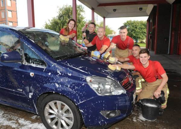 Skegness firefighters are ready to clean your car on Saturday. ANL-160318-104618001