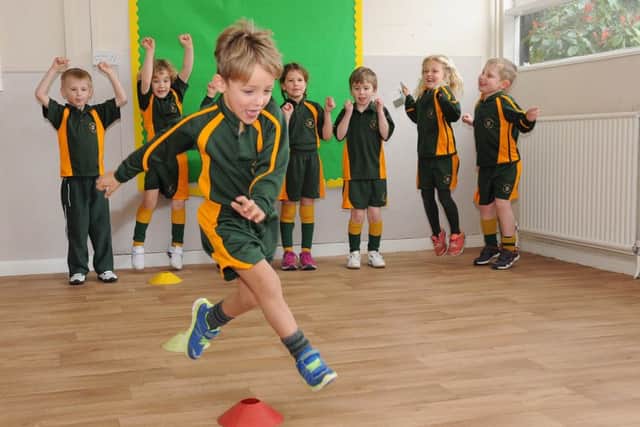 Sports Relief activities at St George's Prep school. Reception and Year 1 pupils doing obstacle course challenges.