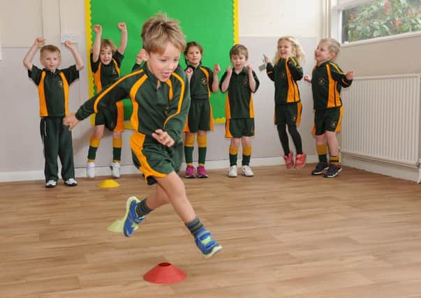 Sports Relief activities at St George's Prep school. Reception and Year 1 pupils doing obstacle course challenges.