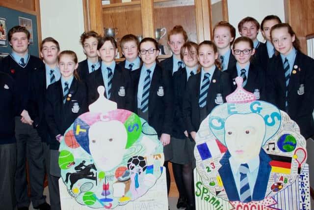 Some of the 16 pupils who took part in the production on the life of Queen Elizabeth I, with the two cut-outs.