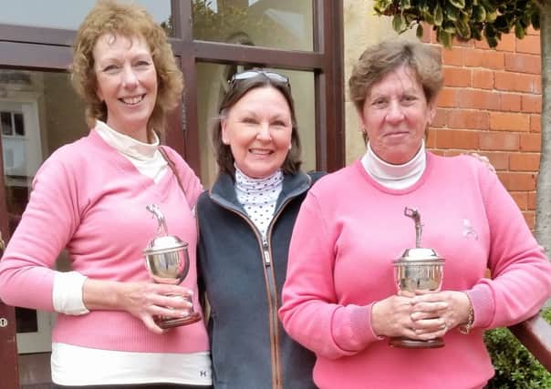 Dawson Trophy winners Rose Stevenson (left) and Lesley Burton (right) with lady captain Penny Buckley EMN-160321-105214002
