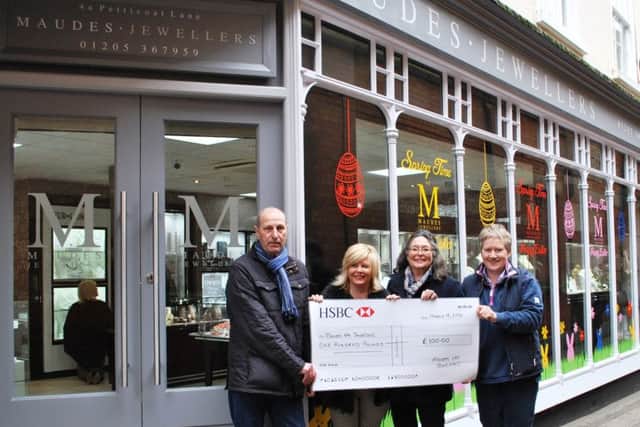 Andrew Maude, second from left, presents her £100 cheque to Boston in Bloom committee members, from left, Paul Collingwood, Alison Fairman and Cllr Claire Rylott, borough council portfolio holder for grounds and open spaces.