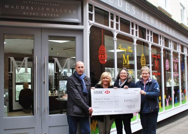 Andrew Maude, second from left, presents her Â£100 cheque to Boston in Bloom committee members, from left, Paul Collingwood, Alison Fairman and Cllr Claire Rylott, borough council portfolio holder for grounds and open spaces.